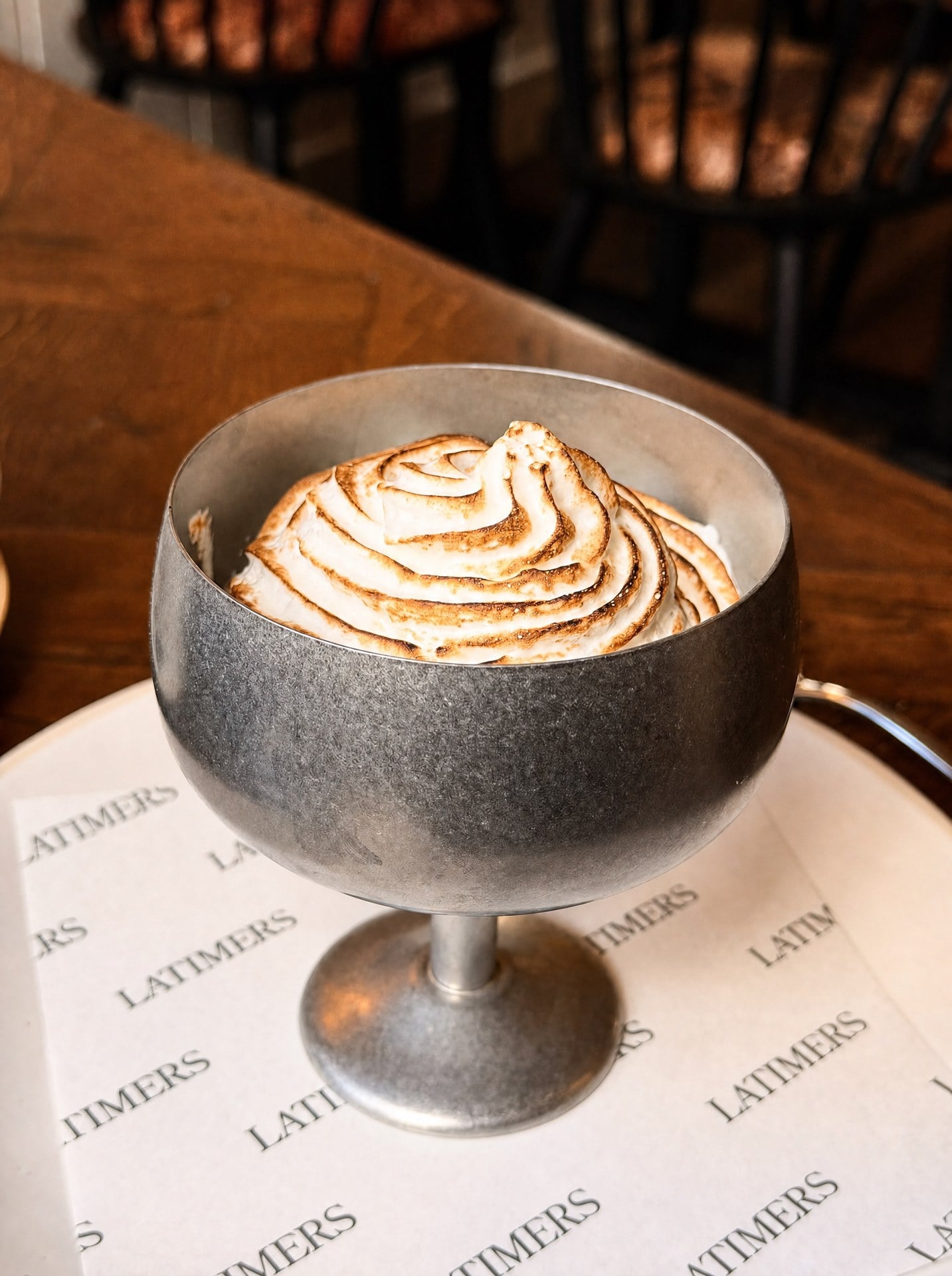 Toasted meringue on Latimers’ baked Alaska, served in a silver cup